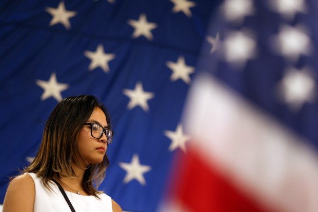 New citizen Phannarai Inkun ,19, leads the Pledge of Allegiance during a naturalization ceremony aboard the USS Hornet Sea, Air & Space Museum on Wednesday, July 1, 2026, in Alameda, Calif. A total of 76 community members from 28 different countries became new American citizens during the ceremony. (Aric Crabb/Bay Area News Group)