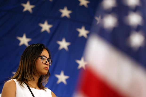 New citizen Phannarai Inkun ,19, leads the Pledge of Allegiance during a naturalization ceremony aboard the USS Hornet Sea, Air & Space Museum on Wednesday, July 1, 2026, in Alameda, Calif. A total of 76 community members from 28 different countries became new American citizens during the ceremony. (Aric Crabb/Bay Area News Group)