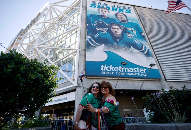 Mexico fans Maria Reyes, left, and Martha Nino, both from Santa Cruz, take a selfie outside of the SAP Center before the Mexico versus England Round of 16 match for the FIFA World Cup at the Soccer Celebration presented by the San José Sports Authority at the SAP Center in San Jose, Calif., on Sunday, July 5, 2026. (Nhat V. Meyer/Bay Area News Group)
