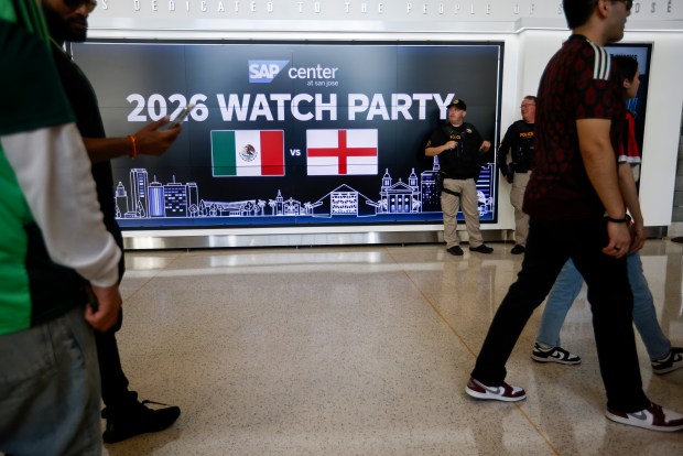 San Jose Police Officers stand guard as Mexico fans wander the concourse at the SAP Center before the Mexico versus England Round of 16 match for the FIFA World Cup at the Soccer Celebration presented by the San José Sports Authority at the SAP Center in San Jose, Calif., on Sunday, July 5, 2026. (Nhat V. Meyer/Bay Area News Group)