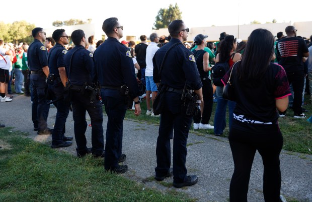 San Jose Police Officers keep watch on soccer fans as they watch the Mexico versus England Round of 16 match in the second half for the FIFA World Cup at the Soccer Celebration presented by El Camino, hosted by the San Jose Earthquakes and San José Sports Authority at the Discovery Meadow in San Jose, Calif., on Sunday, July 5, 2026. (Nhat V. Meyer/Bay Area News Group)
