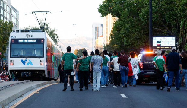 Soccer fans walk east on San Carlos Street following Mexico's 3-2 loss to England in the Round of 16 match for the FIFA World Cup at the Soccer Celebration presented by El Camino, hosted by the San Jose Earthquakes and San José Sports Authority at the Discovery Meadow in San Jose, Calif., on Sunday, July 5, 2026. (Nhat V. Meyer/Bay Area News Group)
