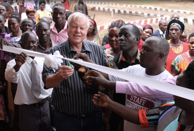 Former San Diego County Supervisor Bill Horn cuts a ceremonial ribbon in 2016 to open Emmaus School in Uganda.(Photo courtesy of Geoff Horn)