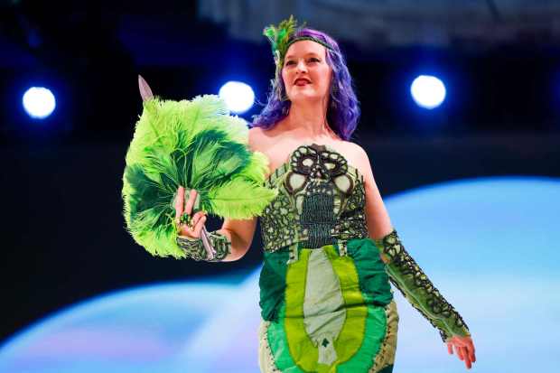 Angela Fenn Gleason wearing their Masters of the Universe inspired design walks the runway during the 10th annual Her Universe Fashion Show as part of San Diego's 2024 Comic-Con International at the Manchester Grand Hyatt on Thursday, July 25, 2024 in San Diego, CA. (Meg McLaughlin / The San Diego Union-Tribune)