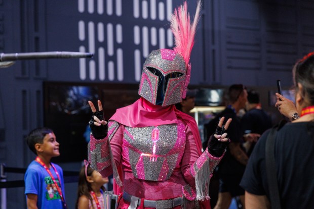 San Diego, California - Sarah Elizabeth, of Phoenix, Arizona, poses while cosplaying as "Glamdalorian," a play on Mandalorian armor from "Star Wars" during Comic-Con on Saturday, July 25, 2026. (Kristian Carreon / The San Diego Union-Tribune)