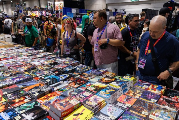 San Diego, California - Attendees look through comics during Comic-Con on Saturday, July 25, 2026. (Kristian Carreon / The San Diego Union-Tribune)