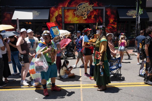 San Diego, CA - People wait in line for activations in the Gaslamp during Comic-Con on Saturday, July 25, 2026, in San Diego, CA. (Luke Johnson / The San Diego Union-Tribune)
