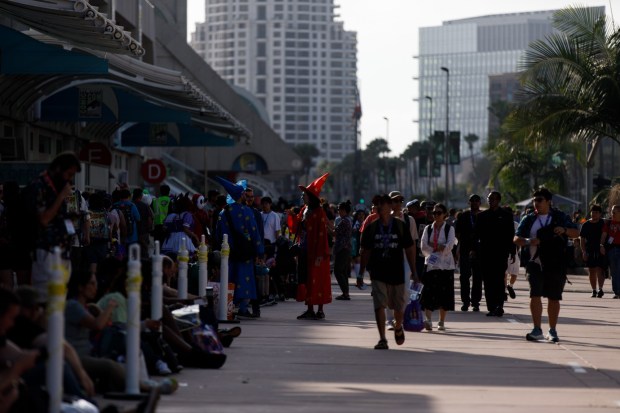 San Diego, California - Attendees walk outside the convention center during Comic-Con on Saturday, July 25, 2026. (Kristian Carreon / The San Diego Union-Tribune)