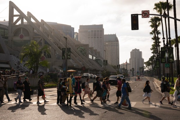 San Diego, CA - People walk to the Gaslamp to visit activations, bars and restaurants during Comic-Con on Saturday, July 25, 2026, in San Diego, CA. (Luke Johnson / The San Diego Union-Tribune)