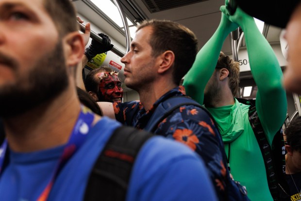 San Diego, California - Attendees take the trolley during Comic-Con on Saturday, July 25, 2026. (Kristian Carreon / The San Diego Union-Tribune)