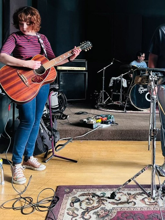 Kelly Davis rehearsing with members of The Luxembourg Signal. Her husband, Brian Espinosa, is on drums. (Brian Espinosa)