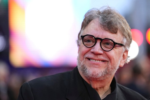 Director Guillermo del Toro poses for photographers upon arrival at the premiere of the film "Frankenstein." At Comic-Con, the Academy Award-winning filmmaker will be on a panel for the 20th anniversary of "Pan's Labyrinth." (Scott A Garfitt/Invision/AP)