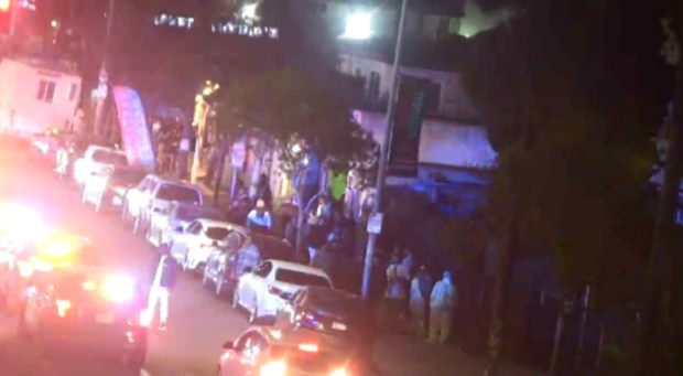 A surveillance camera pointed at the alleged drug market was a key part of the investigation. This image from the camera, taken March 30, 2025, allegedly shows gang members gathering to celebrate a gang holiday and refusing San Diego police orders to disperse. (courtesy of U.S. Attorney's Office for the Southern District of California)