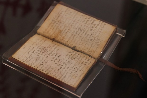 A diary of Ah Quin, an immigrant from Guangdong, China, on display at the San Diego History Center in Balboa Park on Tuesday, June 30, 2026. Quin's diaries show a unique perspective of San Diego from 1876-1902. (Kristian Carreon / The San Diego Union-Tribune)