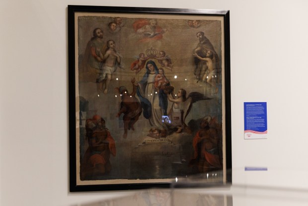 A painting that survived a the Mission San Diego de Alcalá fire on display at the San Diego History Center in Balboa Park on Tuesday, June 30, 2026. (Kristian Carreon / The San Diego Union-Tribune)