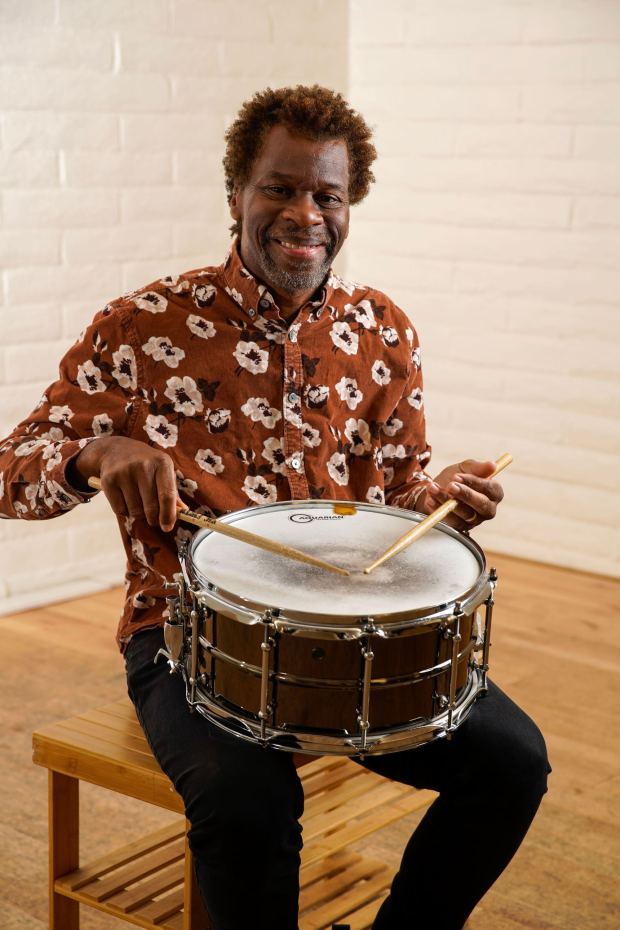 San Diego musicians profiled in 2020 when the pandemic shutdown had brought all of their careers to a halt. Drummer Richard Sellers pose for photo at Tap In With Claudia Dance Studio in City Heights on 05.27.25, in San Diego, California. (Alejandro Tamayo / The San Diego Union-Tribune)