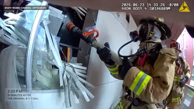 Image from footage San Diego police released Wednesday from a June 23 standoff at a downtown apartment building. Officers fatally shot 32-year-old Josue White, who police said was armed with a large knife. (San Diego Police Department)
