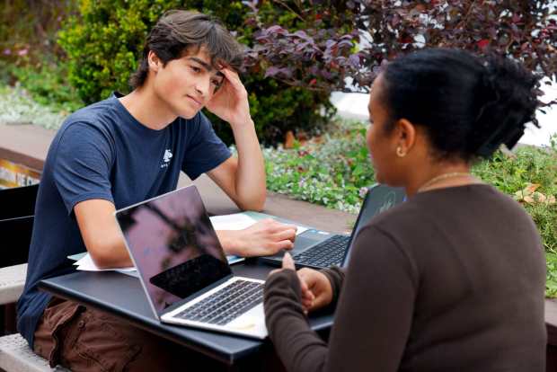 Nikhil Plettner Booker and Ashley Ordaz plan for their later discussion with Sheriff Kelly Martinez on Tuesday, July 14, 2026, in San Diego. (Meg McLaughlin / The San Diego Union-Tribune)