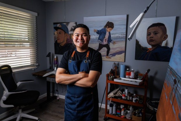 Filipino American artist Joshua Orozco poses at his home studio in Chula Vista on Saturday, June 27, 2026. Orozco's work is displayed in the LGBTQ+ exhibition at The Studio Door in Hillcrest. (Kristian Carreon / The San Diego Union-Tribune)