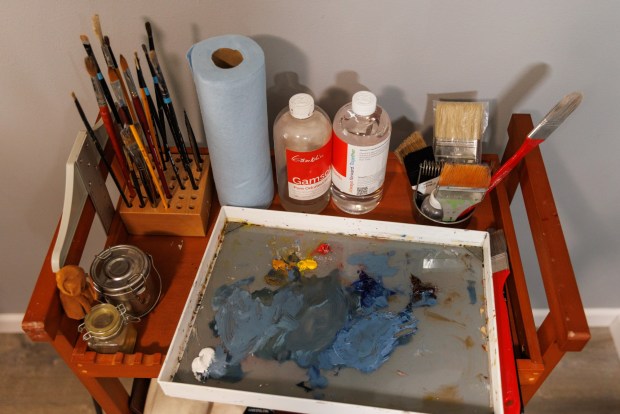 Filipino American artist Joshua Orozco's art supplies at his home studio in Chula Vista on Saturday, June 27, 2026. (Kristian Carreon / The San Diego Union-Tribune)
