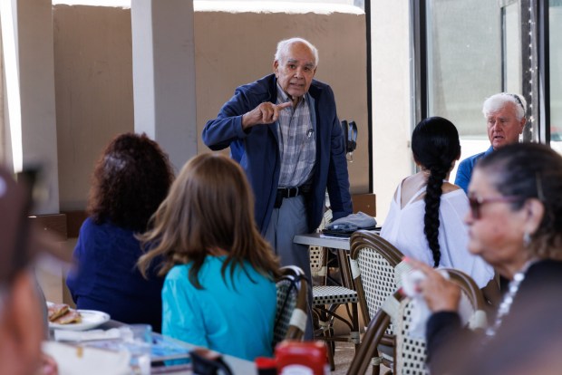 Charles Velazquez, president of Friends of San Ysidro, speaks at a meeting with the group at IHOP in San Ysidro on Thursday, June 25, 2026. (Kristian Carreon / The San Diego Union-Tribune)