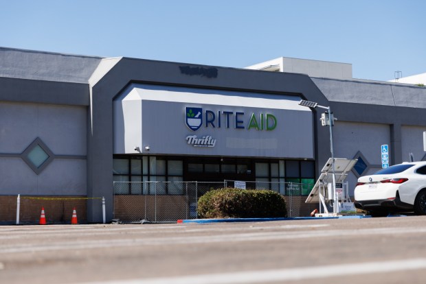 A closed-down Rite Aid, now used as a paid parking lot, in Hillcrest on Thursday, July 23, 2026. (Kristian Carreon / The San Diego Union-Tribune)