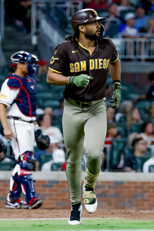 San Diego Padres' Fernando Tatis Jr. jogs around the bases after hitting a two-run home run against the Atlanta Braves during the eighth inning of a baseball game, Tuesday, July 21, 2026, in Atlanta. (AP Photo/Erik S. Lesser)