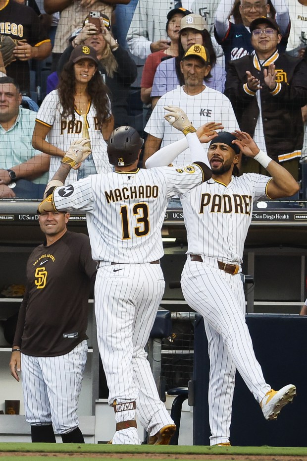 Manny Machado and Fernando Tatis Jr. of the San Diego Padres celebrate after Machado's home run against the Arizona Diamondbacks during the second inning at Petco Park on Thursday, July 9, 2026 in San Diego, California. (Meg McLaughlin / The San Diego Union-Tribune)