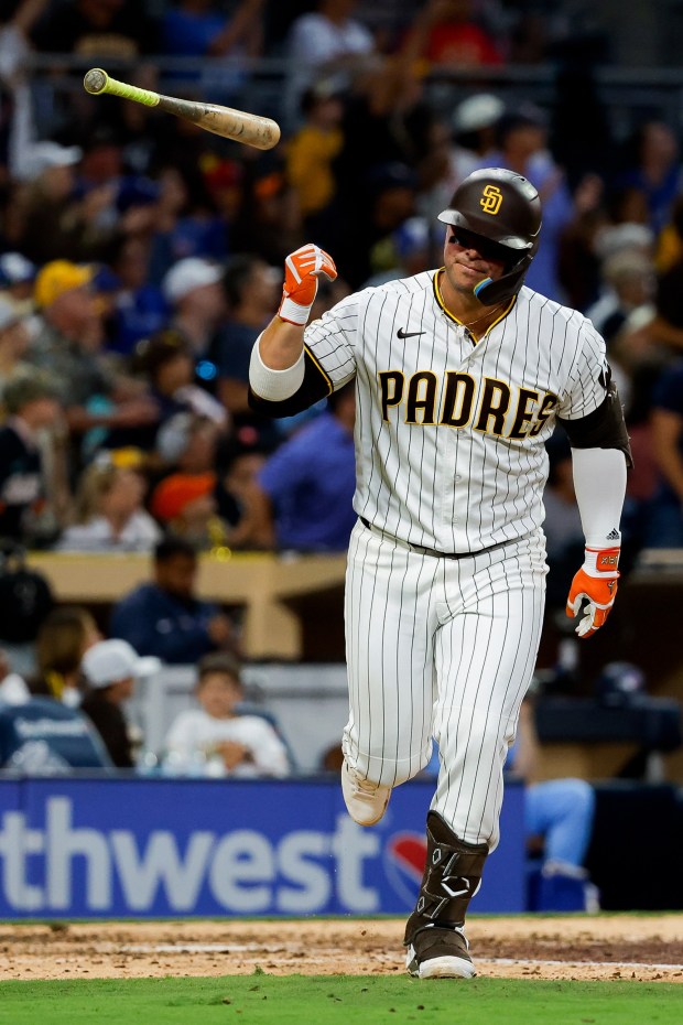 Ty France of the San Diego Padres flips his bat after a home run against the Toronto Blue Jays during the sixth inning at Petco Park on Saturday, July 11, 2026 in San Diego, California. (Meg McLaughlin / The San Diego Union-Tribune)