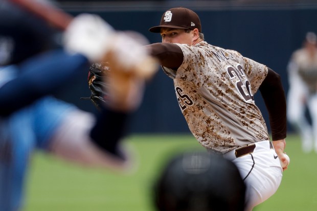 Mason Miller #22 of the San Diego Padres pitches against the Toronto Blue Jays during the ninth inning at Petco Park on Sunday, July 12, 2026 in San Diego, California. (Meg McLaughlin / The San Diego Union-Tribune)