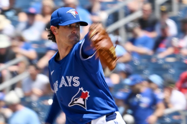 Toronto Blue Jays starting pitcher Shane Bieber throws to a Texas Rangers batter during the first inning of a baseball game in Toronto, Sunday, June 28, 2026. (Jon Blacker/The Canadian Press via AP)