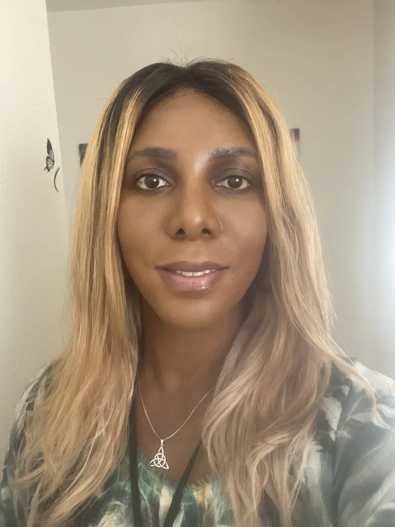 A black woman smiling in a headshot