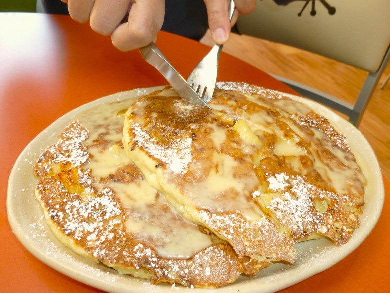A pancake being sliced