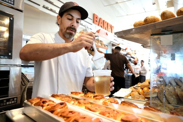 Pastry chef Charlie Lo Grasso puts the finishing touches on freshly baked babka at Bakey bakery in Hallandale Beach, Tuesday, July 21, 2026. (Carline Jean/South Florida Sun Sentinel)