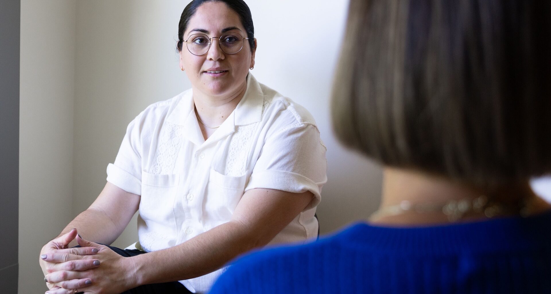 Woman listening to another person.