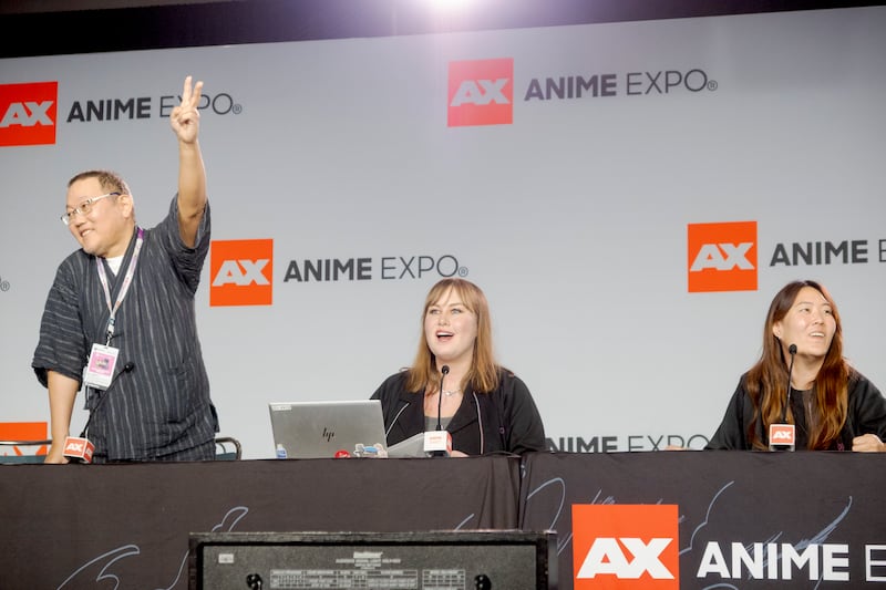 Panelists speaking at a convention