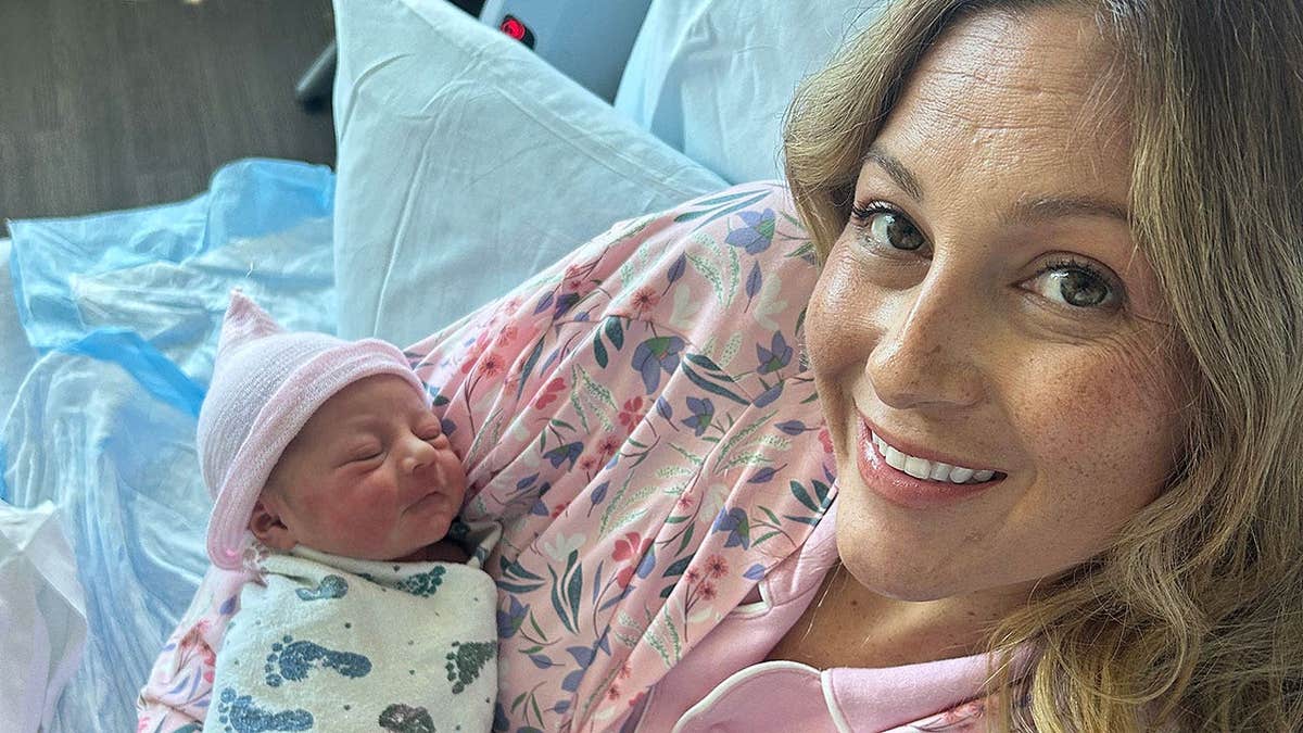 Mother holds newborn after Jack in the Box parking lot birth