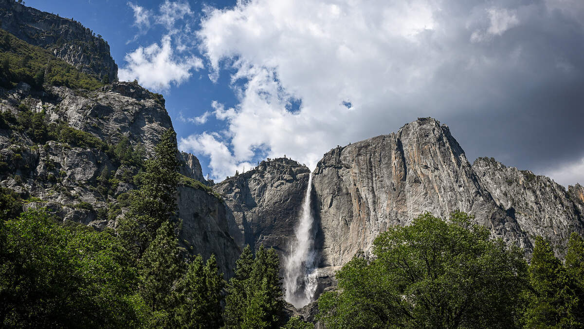 Water pours from Yosemite National Park’s famous Upper Yosemite Falls on a spectacular spring day in the park, Thursday, May 21.