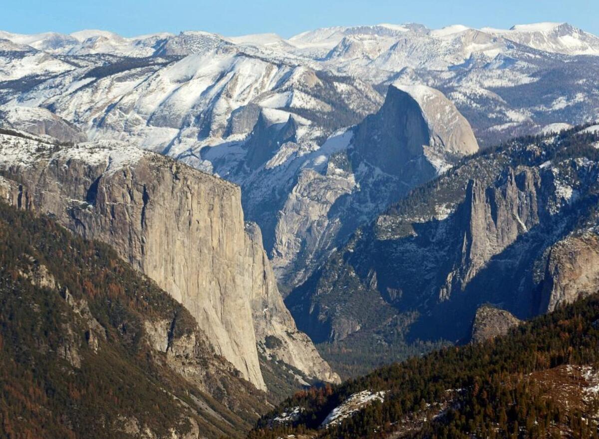 El Capitan, left, and Half Dome are seen in Yosemite Valley from the perspective of a helicopter looking east toward the Sierra Nevada mountains.