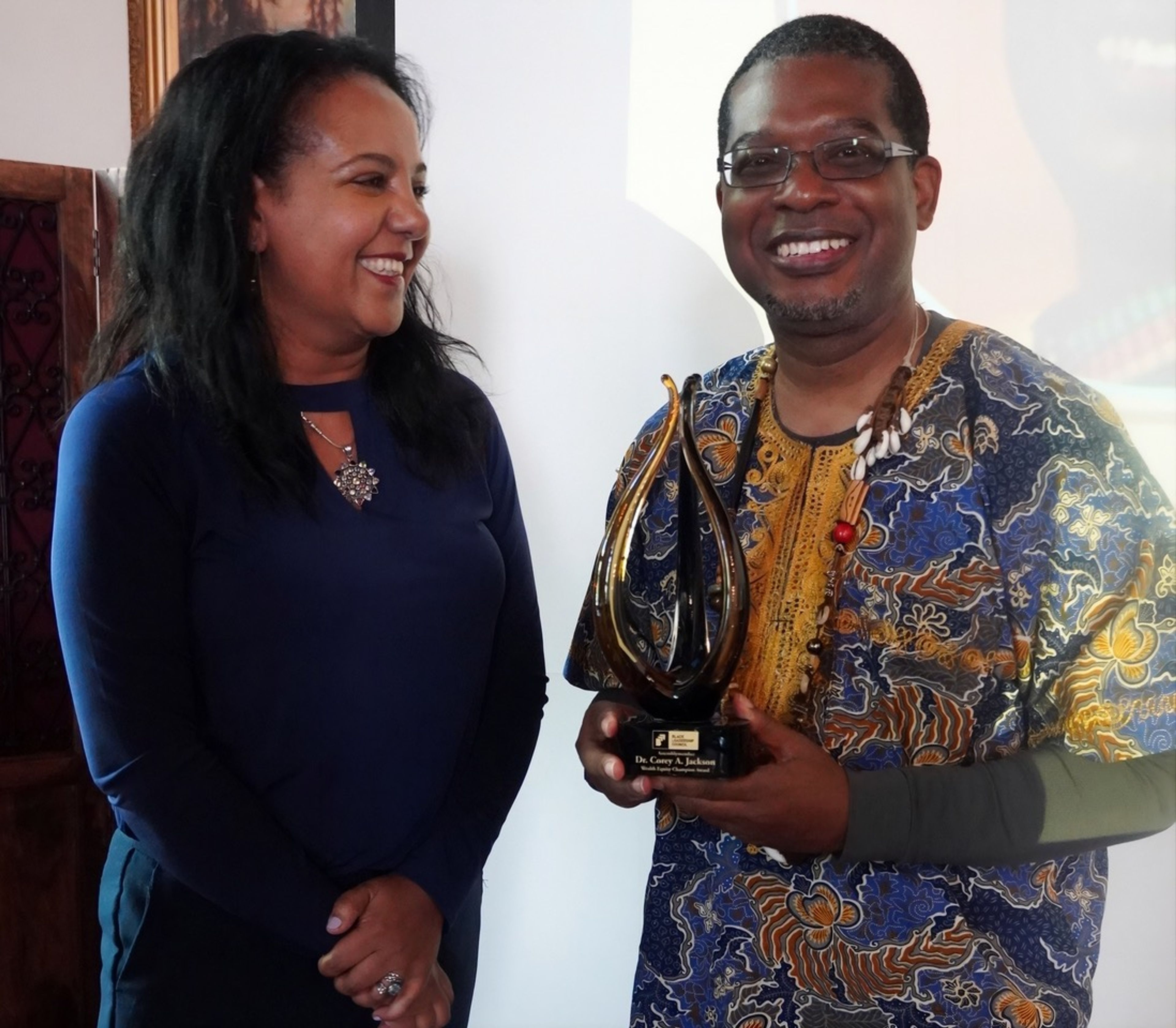 Asm. Corey Jackson (D-Moreno Valley), right, received the Wealth Equity Champion Award from CalVoices and the Black Leadership Council (BLC) in Sacramento on June 17. The award recognizes his commitment to combating poverty, supporting working-class communities, and advancing economic equity across California. It was presented by Meron Agonafer, left, CalVoices' policy director. 