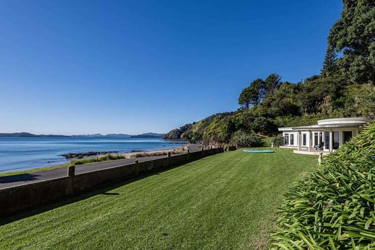 The iconic art deco-style home at 151 Long Beach Road, on the edge of Russell, Northland, is on the market for the first time since it was built in the 1950s. Photo / Supplied