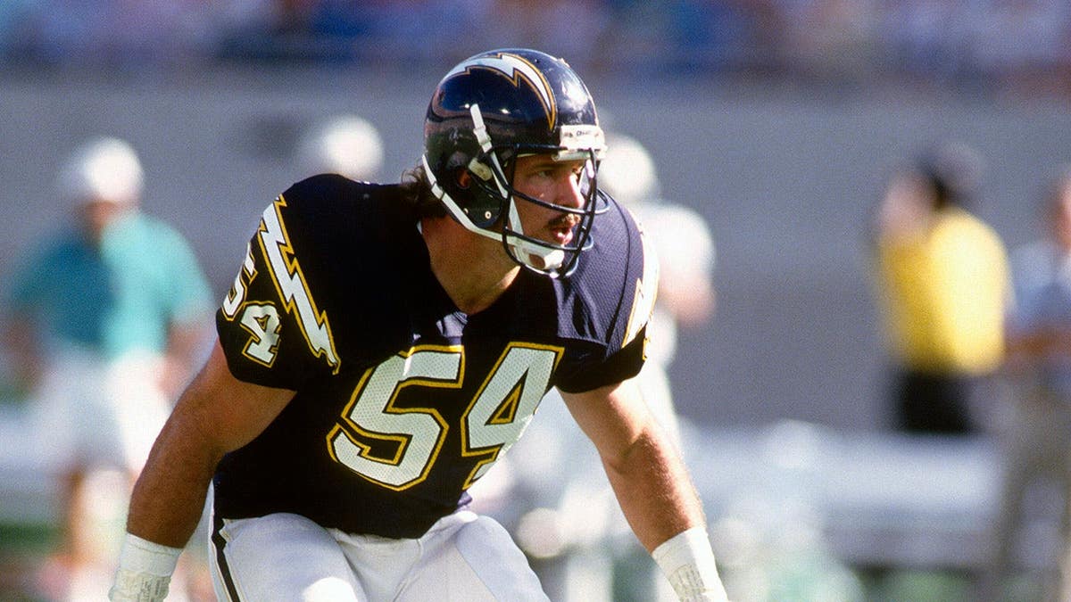 Billy Ray Smith No. 54 of the San Diego Chargers in action against the Miami Dolphins.