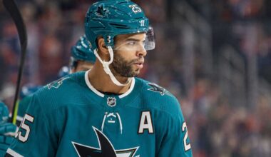 Darnell Nurse wearing a San Jose Sharks jersey and helmet amid Edmonton Oilers trade rumors linking him to San Jose