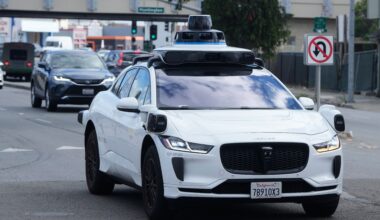FILE - A Waymo vehicle drives past a No U-Turn sign in San Bruno, Calif., Tuesday, Sept. 30, 2025. (AP Photo/Jeff Chiu, File)