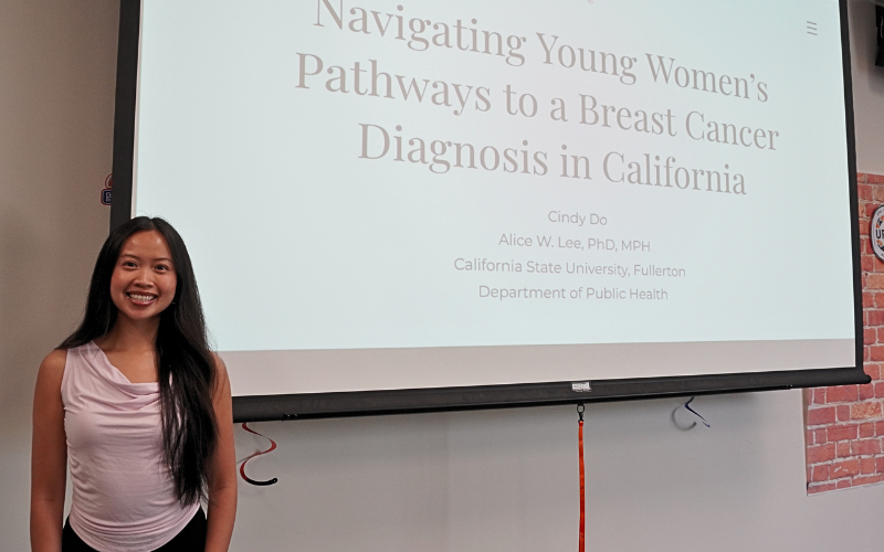 Psychology student Cindy Do presents breast cancer research.