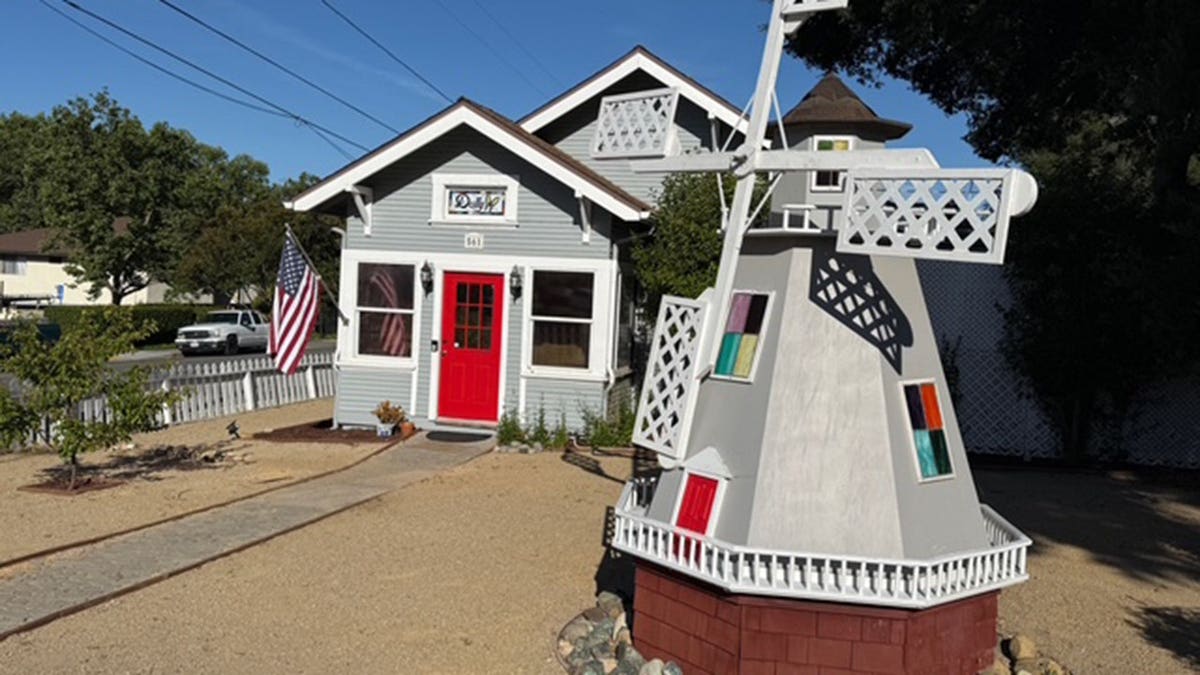 A replica of a larger windmill in front of Parton's former home.