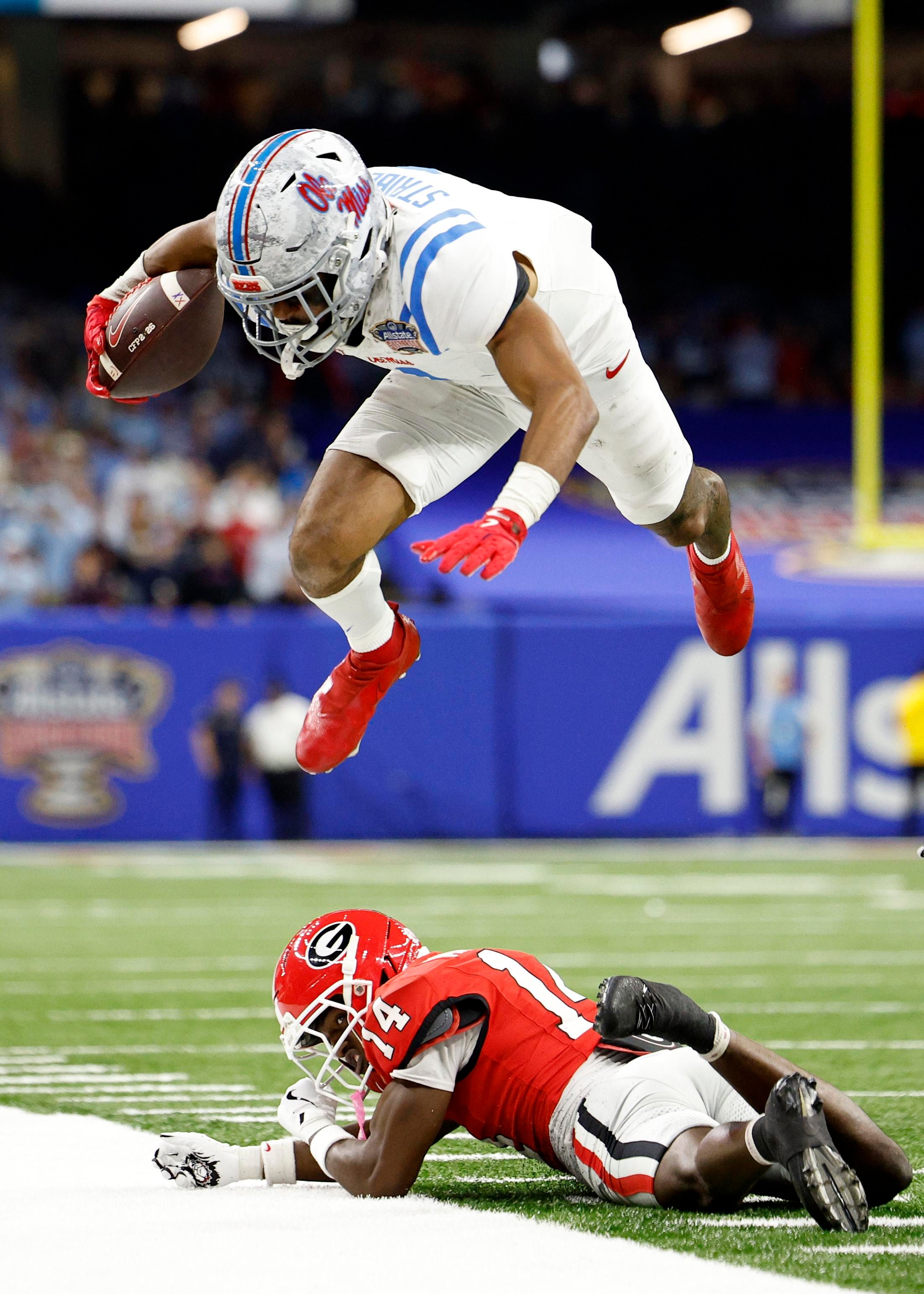 NEW ORLEANS, LOUISIANA - JANUARY 01: De’Zhaun Stribling #1 of the Ole Miss Rebels jumps over Adrian Maddox #14 of the Georgia Bulldogs during the fourth quarter during the 2025 College Football Playoff Quarterfinal at the Allstate Sugar Bowl at Caesars Superdome on January 01, 2026 in New Orleans, Louisiana. (Photo by Sean Gardner/Getty Images)