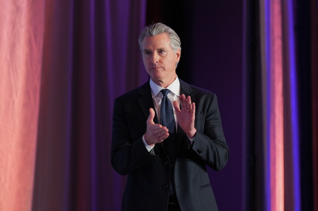 Gov. Gavin Newsom clapping.