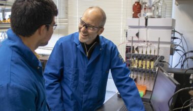 John Hartwig in lab with researcher