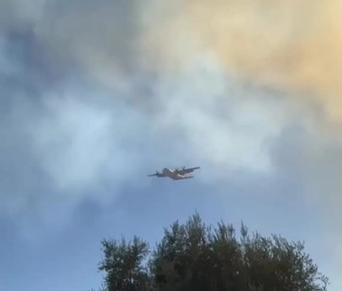 Aerial Tanker Flies Through Smoke During San Diego Fire